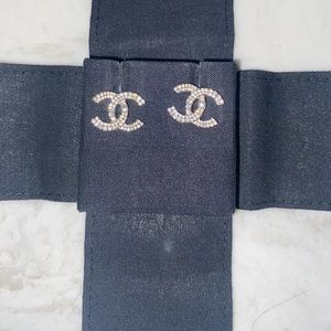 Authentic Chanel gently used double C earrings .